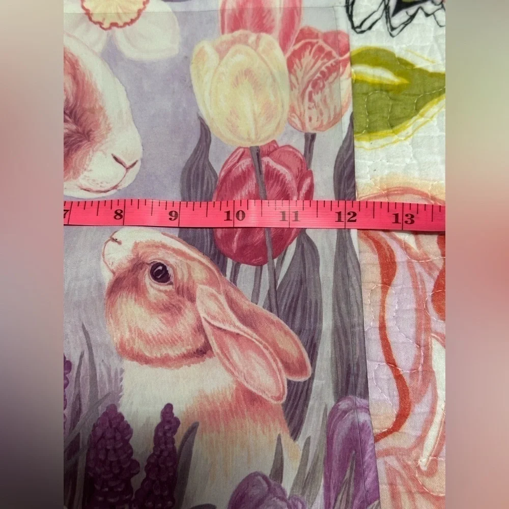 Cute mommy & baby bunny hiding in a garden flag.